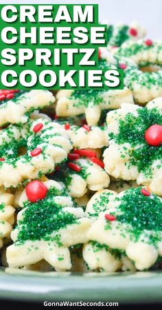 a white plate topped with cookies covered in green and red sprinkles