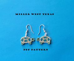 a pair of earrings with the words miller west texas on it and an image of a car