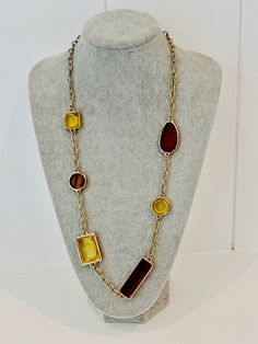 "Vintage Banana Republic long gold tone necklace with amber and yellow colored glass. Signed on the clasp. 29\" long." Yellow Metal Necklace With Adjustable Chain, Long Glass Necklace With Adjustable Chain, Gold Glass Necklaces For Formal Occasions, Gold Glass Necklace With Adjustable Chain, Yellow Bohemian Rectangular Jewelry, Yellow Rectangular Bohemian Jewelry, Formal Gold Glass Necklace, Yellow Bohemian Necklaces With Adjustable Chain, Yellow Bohemian Necklace With Adjustable Chain