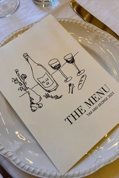 the menu is displayed on a white plate with gold rimmed utensils and silverware