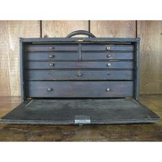 an old wooden dresser sitting on top of a floor