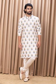 Ivory kurta with all-over phulkari motifs. Comes with an ivory churidar.
Component: 2
Type Of Work: Phulkari
Neckline: Mandarin Collar
Sleeve Type: Straight Long
Fabric: Cotton and Silk, Lining: Cotton
Color: Ivory
Other Details: 
Note: Pant worn by the model is not for sale
Occasion: Sangeet - Aza Fashions Phulkari Motifs, Kurta Set For Men, Straight Kurta, Churidar, Kurta Set, Color Ivory, Mandarin Collar, Cotton Silk, Aza Fashion