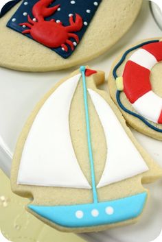 cookies decorated like boats and life preservers on a plate