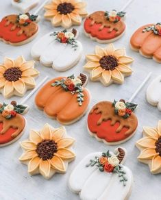 decorated cookies with sunflowers and pumpkins on them