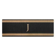 a door mat with the letter j in gold and black stripeing on an isolated white background