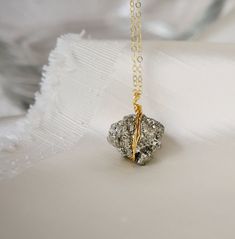 This necklace is handmade with natural Pyrite cluster that's wrapped in sterling silver or 14k gold filled wire in a freeform style. Each stone varies slightly in size, shape, and crystal structure. This necklace is available in either sterling silver or 14k gold filled. Pyrite Meaning: Pyrite is believed to protect its wearer from negative energy. It is also said to promote physical health and stimulate the second and third chakras to help enhance strength of mind and willpower.Stone Size: Aver Pyrite Meaning, Pyrite Pendant, Pyrite Necklace, Fools Gold, Crystal Structure, Pyrite Crystal, Tourmaline Bracelet, Fool Gold, Tourmaline Jewelry