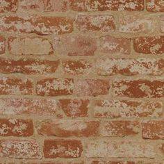 an old brick wall is shown in brown and tan tones, with white spots on the bricks