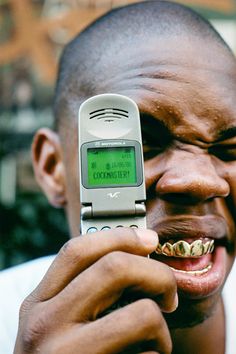 a man holding up a cell phone to his face