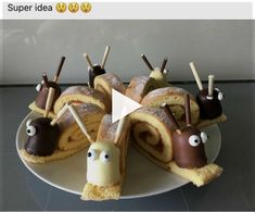 there is a cake made to look like snails with chocolate on top and eyes