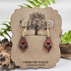 These Heart Dangle Earrings are a heartwarming gift idea! Handcrafted with locally sourced cedar wood, these earrings feature a unique two heart teardrop design. The hypoallergenic hardware ensures comfort for all wearers. Show someone you care with these lovely earrings! These handmade earrings measure:2 1/8 inches or 5.4 CM including hook.