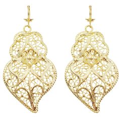 Features: Made in Portugal: Crafted with care and tradition, ensuring high-quality artistry and authenticity. Filigree Metal Construction: Features intricate filigree work that showcases a delicate and detailed design, adding elegance to any outfit. Elegant Gold Color: The stunning gold hue enhances the beauty of the earrings, making them a versatile accessory for both casual and formal occasions. Unique Viana Heart Design: Inspired by the iconic Viana heart, symbolizing love and tradition, these earrings make a meaningful gift or a lovely personal statement. Comfortable Hook Design: Designed for ease of wear, the hook style ensures they stay securely in place while providing comfort throughout the day. Sizes: (LxW) Small: 2.5" x 1.25" Large: 3" x 1.5" Product Description: Elevate your acc Traditional Heart-shaped Jewelry For Festive Occasions, Traditional Gift Heart Earrings Pierced, Ornate Filigree Earrings For Anniversary, Traditional Heart-shaped Earrings, Traditional Pierced Heart Earrings, Ornate Heart-shaped Jewelry With Intricate Design, Traditional Heart Earrings, Elegant Heart Shaped Filigree Jewelry, Elegant Heart-shaped Filigree Jewelry