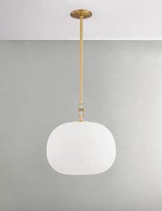 a white light hanging from the ceiling in a room with gray walls and flooring