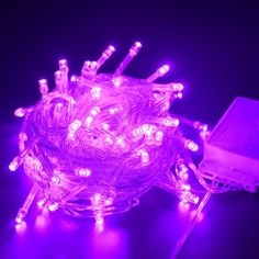 purple fairy lights are on the ground with a laptop in the background and $ 4 98