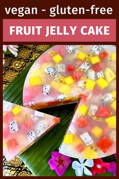 a fruit jelly cake on a plate with flowers around it and the text vegan - gluten - free fruit jelly cake