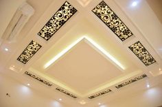 a living room filled with lots of furniture and decor on top of a white ceiling