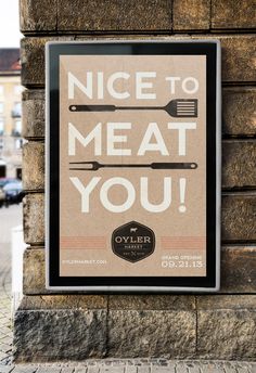 a sign that says nice to meat you on the side of a brick building with two cooking utensils