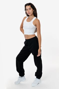 Made from a luxurious 14oz fleece, this sweatpants is incredibly soft and warm, yet still breathable and moisture-wicking. The relaxed fit allows for a full range of motion, making it perfect for lounging around the house, running errands, or hitting the gym. This sweatpant is Piece Dyed. Our piece-dyed sweatpants fabric is dyed before they're cut and sewn, which results in a more uniform color distribution throughout. This means you'll get pants with a cleaner, sharper look, without any color variations. Features: Made from our premium 14oz heavyweight fleece to keep you warm Relaxed fit for a full range of motion Side pockets: Keep your hands warm or store your essentials on the go. Single back pocket: Store your phone, wallet, or keys securely. Elastic waistband and ankle hem: Ensures a Denim Workwear, Fleece Sweatpants, Easy Trendy Outfits, Leather Denim, Ribbed Crop Top, Fleece Pants, Phone Wallet, Range Of Motion, Cropped Tank Top