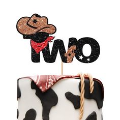 a cow cake with the word two on top