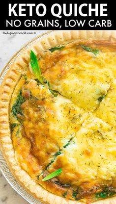 a quiche with spinach and cheese in a pie pan on a marble table