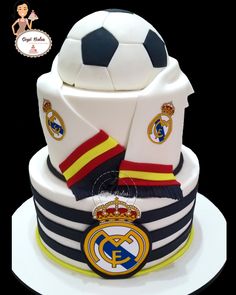 this is a cake made to look like a soccer ball and uniform on top of it