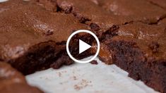 a chocolate brownie cut in half on top of a table