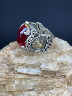 Red Zircon With Lion Figured Silver Men's Ring | Handmade | 20g | Free Shipping 🔹 Discover the allure of our handcrafted Zircon Stone ring, designed for those who appreciate elegance and sophistication. This remarkable men's ring, weighing a solid 20 grams, features a dazzling Zircon gemstone that captures and reflects light in a mesmerizing array of colors. 🔹 Key Features: *Material: Premium Silver *Gemstone: Zircon *Weight: 20 grams *Design: Handcrafted for unique beauty *Guarantee: 1 year ? Antique Red Gemstone Signet Ring, Antique Red Signet Ring For Anniversary, Collectible Red Ruby Ring With Polished Finish, Silver Ruby Rings For Collectors, Collectible Red Rings With Polished Finish, Collectible Red Jewelry With Polished Finish, Red Polished Finish Collectible Jewelry, Collectible Red Engraved Ring, Red Oval Signet Ring Collectible