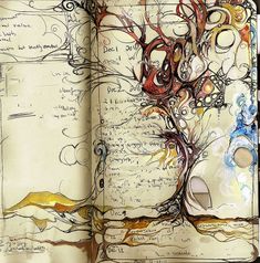 an open book with drawings and writing on the pages, including a leafy tree