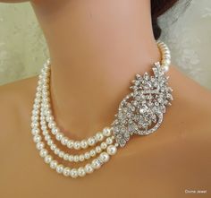 "This glamorous necklace has a vintage inspired brooch and Swarovski pearls in white. Brooch has clear rhinestones and leaves, and measures 3\" by 1 1/2\" at its widest point. Pearls measure 8, 6 mm in the middle strand accented with rhinestone roundelles. Necklace is 17\" long inner strand. Finished off with a silver hook and eye closure. Pearls can be substituted with ivory/cream color and size adjusted. Convo me with color preference and if you need me to adjust the length and will be happy t Wedding Necklace Pearl, Pearl Necklace Bridal, Wedding Necklace Set, Bridal Jewelry Vintage, Bridal Pearl Necklace, Pearl Necklace Wedding, Bridal Necklace Set, Necklace Bridal, Necklace Wedding