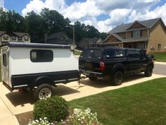 a truck pulling a trailer with a camper attached to it's back end