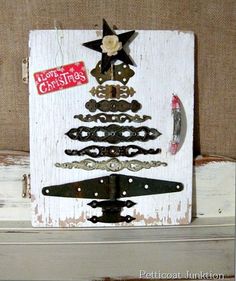 a christmas tree made out of old door knobs