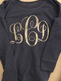 When ordering, the color choices refer to sweatshirt colors.  Choose your font and monogram in a message to me when you purchase.  Feel free to message me to inquiry about a style or color prior to purchasing if you're unsure.   Font: see photo of my fonts and select font choice.  Monogram color: I can do any color! Also include the monogram in the order you want it to appear (first, last, Middle) Sweatshirt Colors, Monogram Sweatshirt, Womens Sweatshirts, A Style, Me When, Color Choices, Dress Pants, Sweatshirts Women, I Can