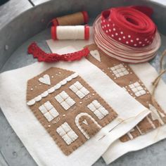 some crafting supplies are laying out on a metal tray with twine spools