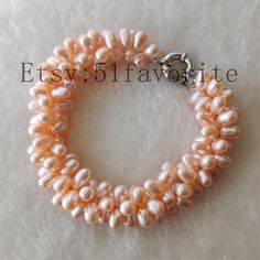 Jewelry: pearl bracelet, cultured fresh water pearl Color: white , pink, natural color Bracelet length: about 7.5-8 inch Grade: AAA, have a few natural blemish on the pearl's surface Size: about 7-8mm Length: please choose your favorite length, if your need other length, please contact me! Handwork: knotted Shipping: I will send out your order in 1-5 business days. Usually will take about 25-65 business days. Thanks! Formal Round Pearl White Bracelets, Formal Pearl White Round Bracelet, Pearl White Round Pearl Drop Bracelet, White Round Hand-strung Pearl Bracelet, Elegant White Nickel-free Pearl Bracelet, Bridesmaid Pearl Bracelet, Real Pearl Bracelet, Pearl Jewelry Gift, Pearl Bride