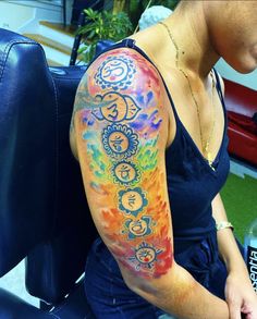 a woman with a colorful tattoo on her arm