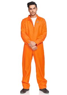 a man in an orange jumpsuit standing with his arms crossed