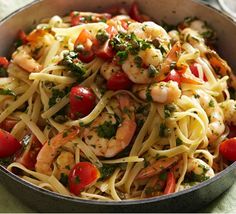 pasta with shrimp and tomatoes in a pan