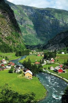 a river running through a lush green valley