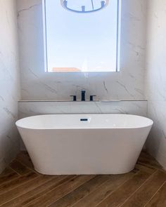 Another example of a beautiful herringbone pattern is this warm brown flooring with visible grain lines. Due to its placement in an area very susceptible to water damage, synthetic laminate flooring or wood-look tile are great options to sustain through water spills. The grout lines in between the planks are also a detail that cannot be overstated...   Image: the.modernhomebody