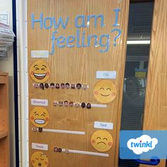 a classroom door decorated with stickers that say how am i feeling? and smiley faces