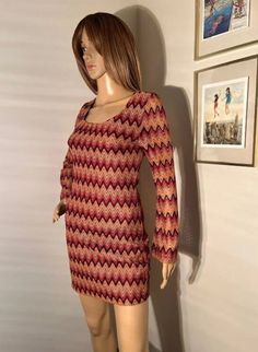 "Vintage 70s bell sleeve chevron dress. Best fits XS/S. Tight on the hips and booty. Very flattering. Waist 14\" Length 24\" Shoulder to shoulder 13.5\" Pit to pit 16.5\" Dress is stretchy For reference, mannequin measurements are as follows: Height: 69\" (5'9\") Chest: 32\" Waist: 24\" Hip: 34\"" Multicolor Stretch Mini Dress For Fall, Fitted Multicolor Bodycon Dress For Fall, Multicolor Stretch Bodycon Dress For Fall, Retro Long Sleeve Mini Dress For Fall, Fall Retro Long Sleeve Mini Dress, Retro Stretch Dresses For Fall, Retro Fitted Mini Dress For Fall, Fitted Retro Mini Dress For Fall, Fitted 70s Inspired Fall Dresses