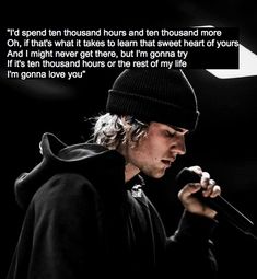 a man holding a microphone in front of a black background with the words, i'd spend ten thousand hours and ten thousand thousand thousand thousand