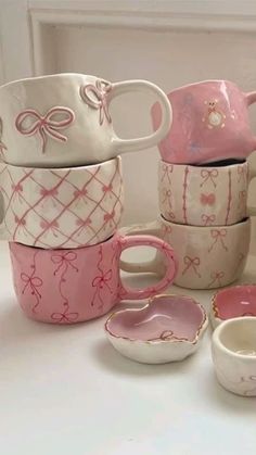 pink and white dishes with bows on them