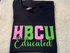 Celebrate your HBCU with this HBCU Educated black unisex t-shirt available in Pink and Green, red and white, and blue and white.  Other options are available upon request. Specifications for other colors should be added in the personalization section.   The graphic is a heat transfer vinyl pressed with a professional heat press.  All personalization are placed under the word Educated.  All personalization are in red, pink, white, or the color of the H and C. Check out the rest of my listings her Black Pre-shrunk School Spirit Shirt, Black School Spirit Shirt With Text Print, Black Shirt With Text Print For School Spirit, Sorority Names, Scene Outfits, College T Shirts, Iron Shirt, Nursing Shirts, Transfer Vinyl