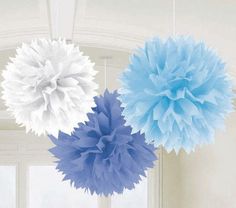 three blue and white pom poms hanging from strings