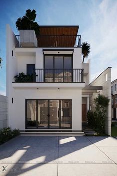 a white two story house with balconies and plants on the balcony