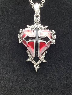 "Red heart with black cross on silver color chain. 30\" length." Gothic Heart Pendant Necklace For Halloween, Gothic Red Nickel-free Necklace, Red Gothic Necklace Nickel Free, Red Gothic Nickel-free Necklace, Red Gothic Cross Necklace, Red Gothic Heart Pendant Jewelry, Silver Emo Jewelry For Valentine's Day, Red Cross Necklace For Valentine's Day, Halloween Gift Necklace With Cross Pendant