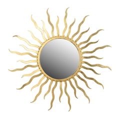 a gold sun mirror on a white wall