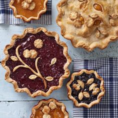 three pies with different toppings sitting on top of each other