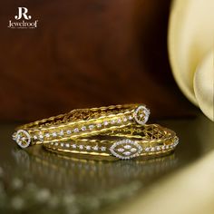 Indulge in the exquisite details of our diamond bangles. A wrist masterpiece.  Shining diamonds and lustrous gold unite flawlessly.  Shop now at Jewelroof.com.  Diamond Bangle : G18263068D Gr. Wt. : 16.470 Gms Diamond Bangle : G18263066D Gr. Wt. : 16.300 Gms  #DiamondBangles #JewelRoof #RatanlalCBafnaJewellersNashik #JewelroofMasterpieces #TimelessElegance  #RCBafnaJewellers #ExquisiteJewellery #jotd #DivineElegance #GoldJewelry #RCBafnaJewellers #ExquisiteCraftsmanship Price Cod, Platinum Jewellery, Om Pendant, Jewellery Brand, Gold Jewelry Earrings, Platinum Jewelry, Exclusive Jewelry