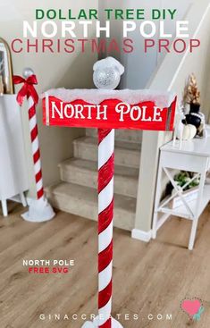 a red and white pole with a sign that says north pole christmas prop on it